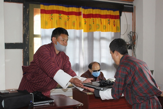 photo: Karma Wangchuk with laptop.
